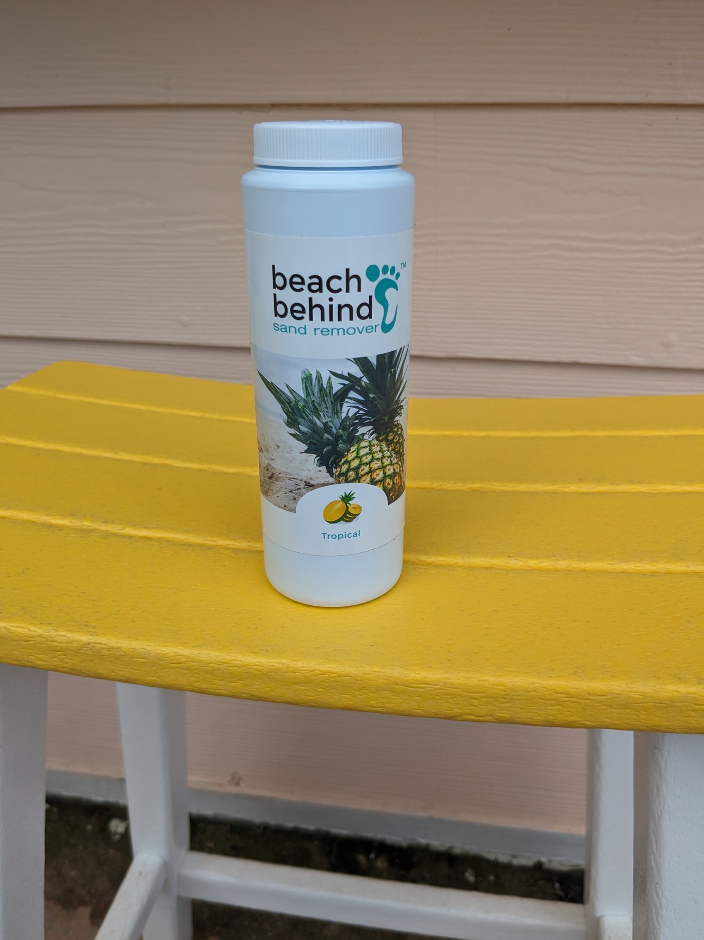 yellow beach chair with tropical scent beach sand remover