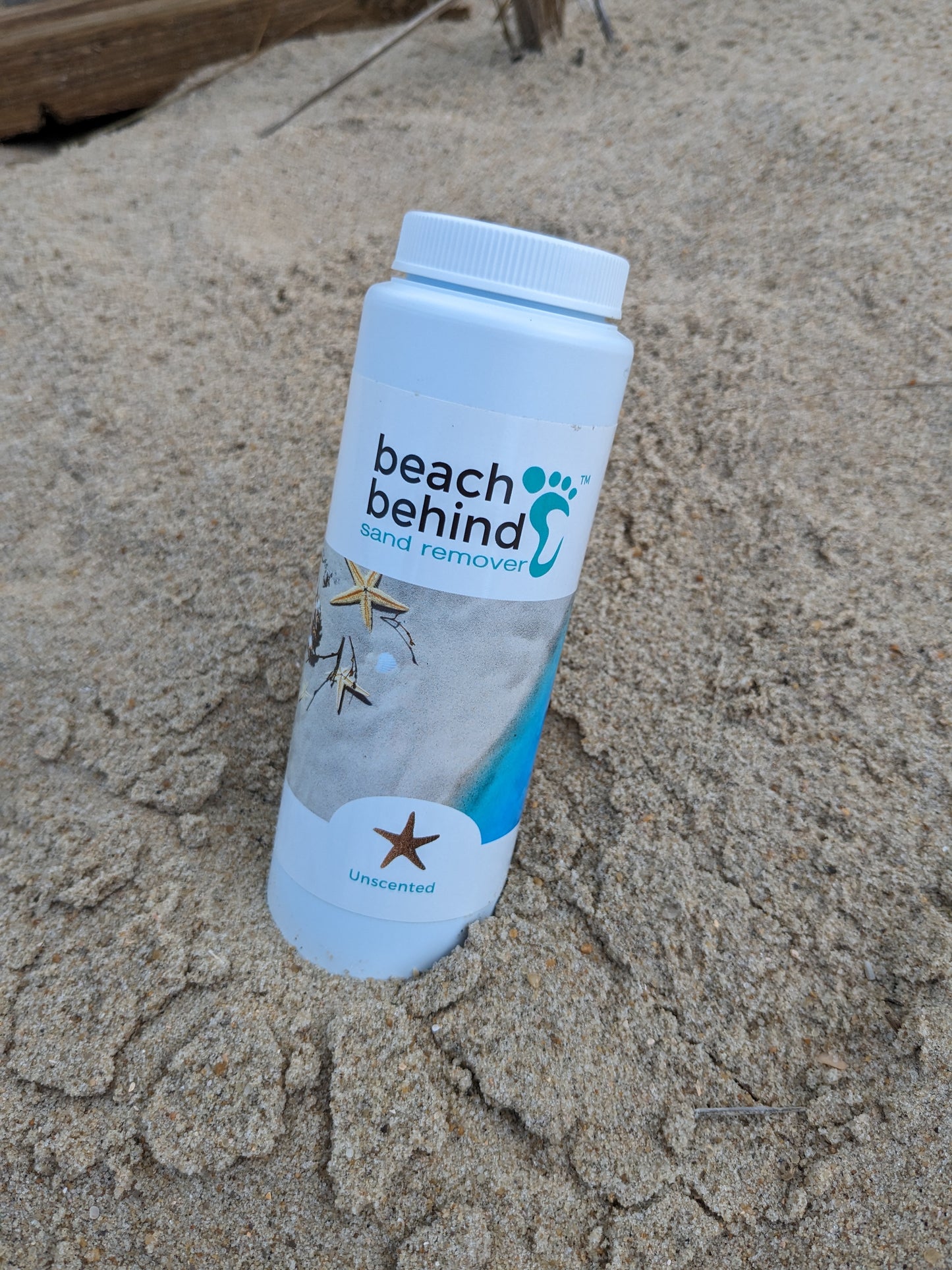 Beach with a bottle of beach sand remover